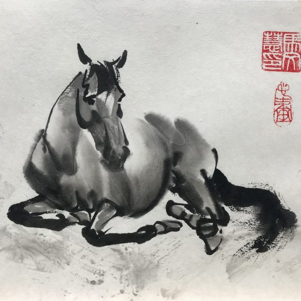 Chinese brush painting of a horse laying down at rest